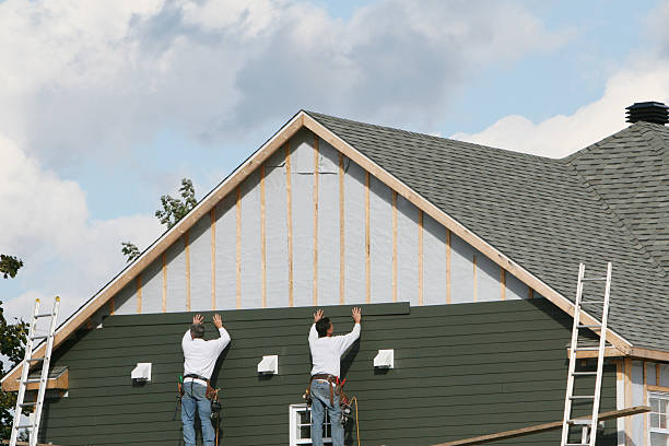 Professional Storm Damage Siding Repair technician working in Jerusalem, OH